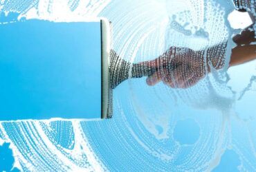 Cleaning,Window,With,Squeegee,Blue,Sky